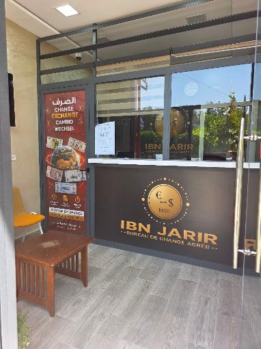 Enseigne extérieure du Bureau de Change IBN JARIR à Deroua Résidence Al Madina.
